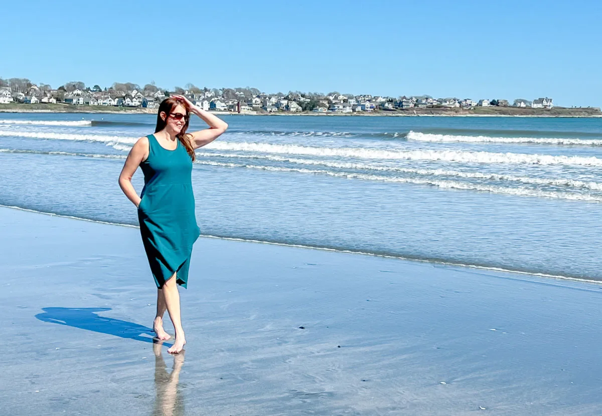 Woman on beach in green dress